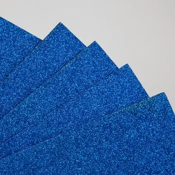 Samples of blue shiny foam sheets. Products for creativity. Stock Photos