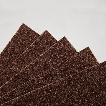 Samples of brown shiny foam sheets. Products for creativity. Stock Photos
