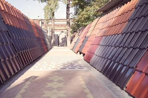 Samples of ceramic roofing tiles in a warehouse of a roofing mat Stock Photos
