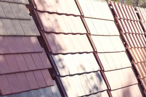 Samples of ceramic roofing tiles in a warehouse of a roofing mat Stock Photos