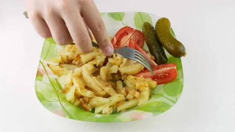 Samples chopped tomato.Fried potatoes with fresh vegetables.Pickles in a dish. Stock-Footage 136895256