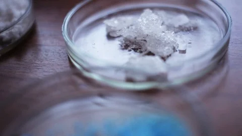 Samples of colored different chemical materials lying on the table in research Stock Footage 98553165