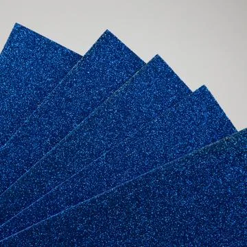 Samples of dark blue shiny foam sheets. Products for creativity. Stock Photos