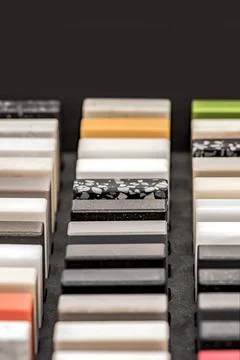 Samples of decorative artificial stone, close-up. Stone samples for kitchen Stock Photos