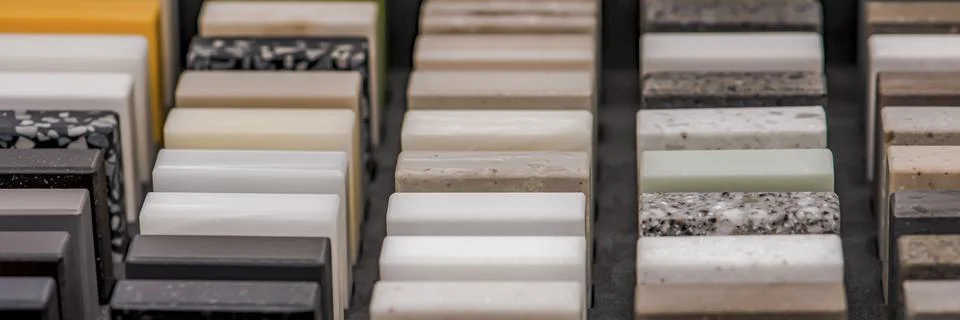 Samples of decorative artificial stone, close-up. Stone samples for kitchen Stock Photos