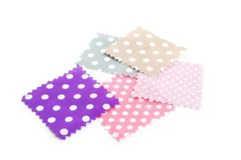 Samples of fabrics with polka dot pattern isolated on white Fotos de archivo