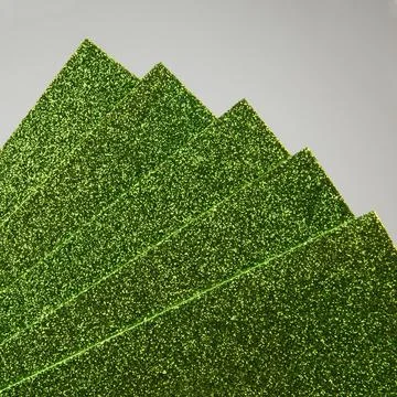 Samples of green shiny foam sheets. Products for creativity. Stock Photos