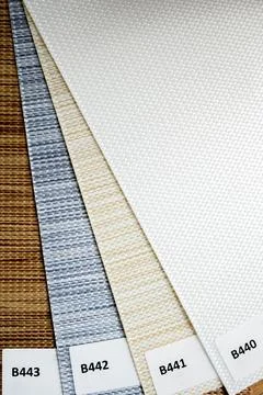 Samples of interior roller blinds of different textures and colors. use of ro Stock Photos