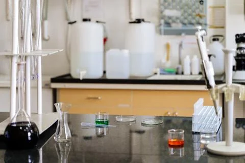 Samples in lab glassware surrounded by lab equipment in hospital laboratory Stock Photos