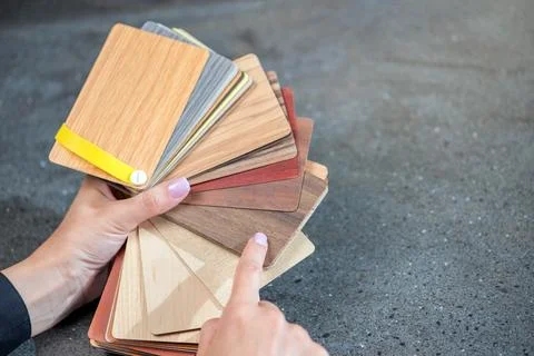 Samples of laminate in the hands of the designer. Selection of samples of Stock Photos