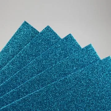 Samples of light blue shiny foam sheets. Products for creativity. Stock Photos