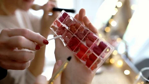 Samples of lipsticks in a plastic container with compartments Stock Footage 121040588