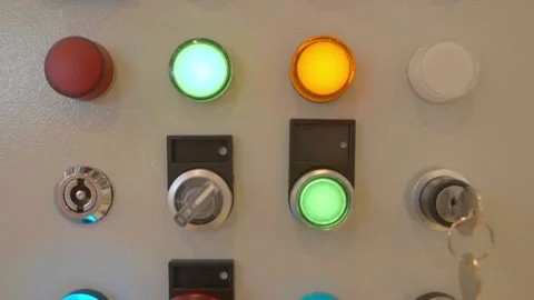Samples of multi-colored backlit pushbuttons, switches and emergency stop button Stock-Footage 333418874