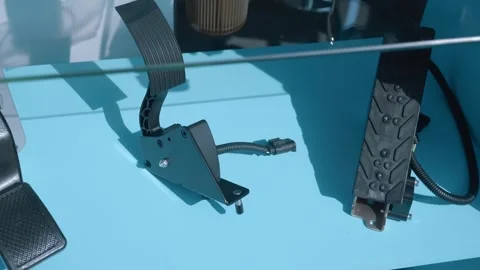 Samples of new car pedal assemblies are presented at the exhibition Stock-Footage 340625343