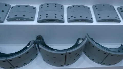 Samples of new drum brake shoes for trucks are on display at the exhibition Stock Footage 340625832