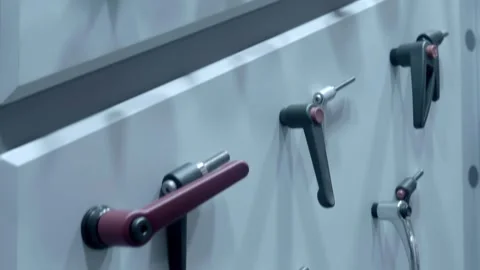 Samples of new industrial door handles are presented at the exhibition Stock Footage 340627321