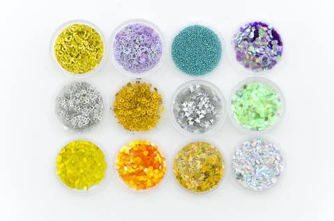 Samples of sequins of strases and nail polish colors. Flat lay, top view Stock Photos