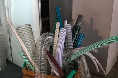 Samples of spiral hoses in the store. Stock Photos