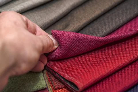 Samples of textiles for upholstery in different colors and thicknesses. Closeup Stock Photos