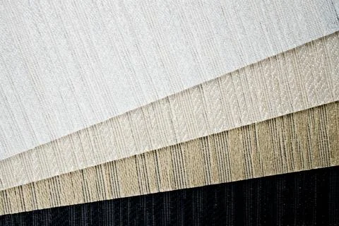 Samples of textured fabrics of different colors for the manufacture of fabric Stock Photos