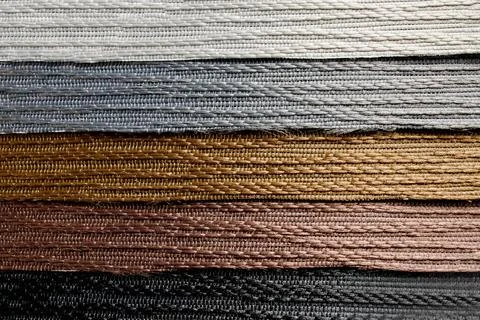 Samples of textured fabrics of different colors for the manufacture of fabric Stock Photos