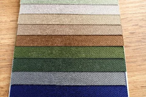 Samples of textured fabrics of different colors for the manufacture of fabric Stock Photos