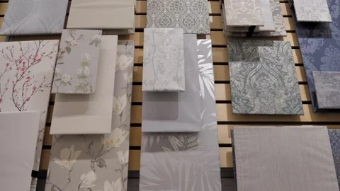 Samples of wallpaper and wall textures are presented on display at a hardware Stock Footage 297817452
