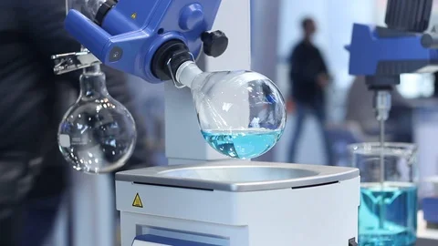 Samples of water in the flasks are mixed in a modern laboratory Stock Footage 87135906
