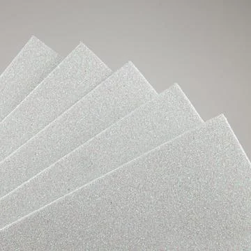 Samples of white shiny foam sheets. Products for creativity. Stock Photos