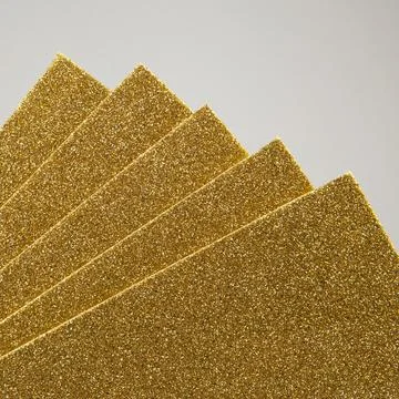 Samples of yellow shiny foam sheets. Products for creativity. Stock Photos