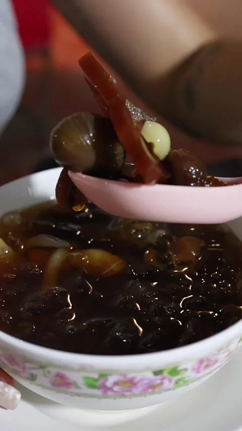 Sampling Assorted Beans in Syrup at Bangkok Street Food Stall Stock Footage 317361261