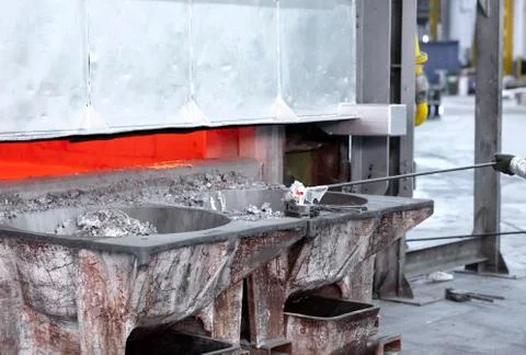 Sampling metal liquid in a foundry Stock Photos