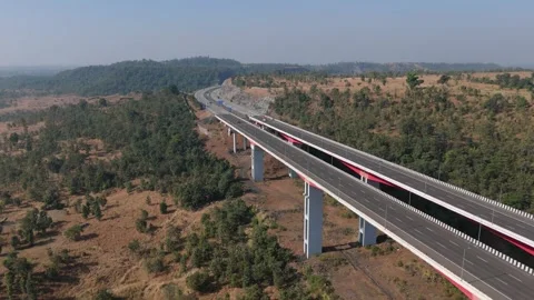 Samruddhi Expressway curving through dry landscape aerial India Stockbeeldmateriaal 336014789