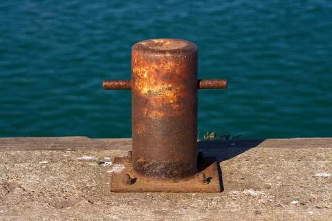 A samson post style single bitt mooring bollard for boats Stock Photos
