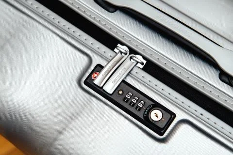 Samsonite suitcase briefcase with focus on the logo and TSA comb Stock Photos