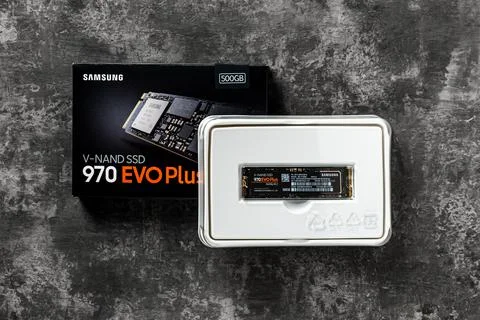 Samsung SSD 970 EVO Plus NVMe and box on a dark background. Stock Photos