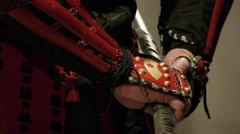 Samurai with the katana sword (close up), front view, sheathing the sword Stock Footage 40764823