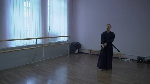 Samurai Performs Movements with the Catana Sword, Kata Kendo Works in the Sports Stock Footage 85956329