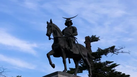 Samurai statue on horseback and blue sky Stock Footage 243868859