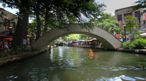 San Antonio Riverwalk View Going Under Bridge on Sunny Day Tracking Shot Stock Footage 67450547