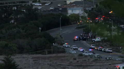 San Bruno fire, base camp on San Bruno Ave, w/ firefighters and police cars Video stock 1002651