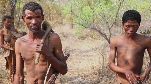 San Bushmen men explaining way of life by speaking in click language. Stock Footage 44113146