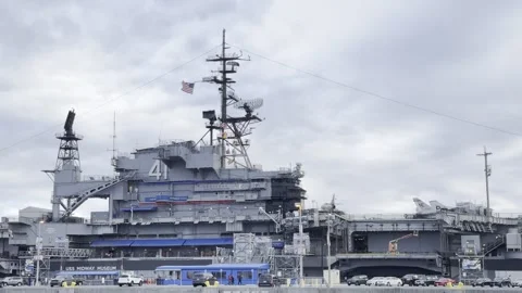 SAN DIEGO, CA - MARCH 12, 2025 - USS Midway aircraft carrier viewed from marina Stock Footage 345265547