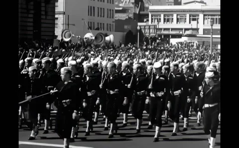 SAN FRANCISCO - 1945 - Another group of Coast Guard men in blues passing in Stock Footage 308103309