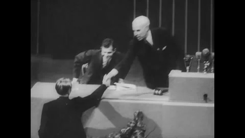 SAN FRANCISCO - 1945: Speaker Gestures Over Microphone-Filled Rostrum 스톡 동영상 342856528