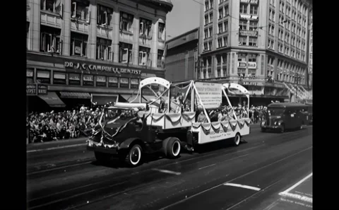 SAN FRANCISCO - 1945 - Truck pulling a trailer loaded with women down the Stock Footage 308100861