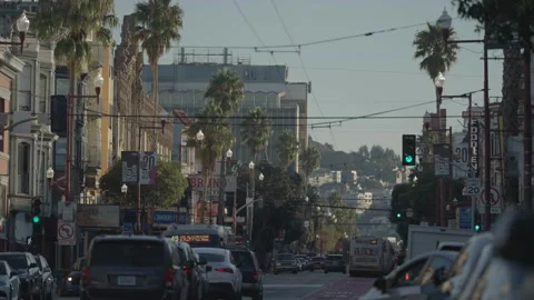 San Francisco, CA - Dec 10, 2024: Wide shot of street with cars foreground, hill Stock Footage 333576095