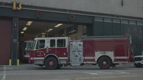 San Francisco, CA - Dec 15, 2024: Fire truck arriving at station Stock Footage 333580606