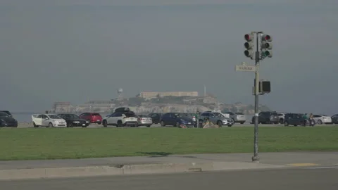 San Francisco, CA - Dec 15, 2024: Wide car parking with Alcatraz background Stock Footage 333580767