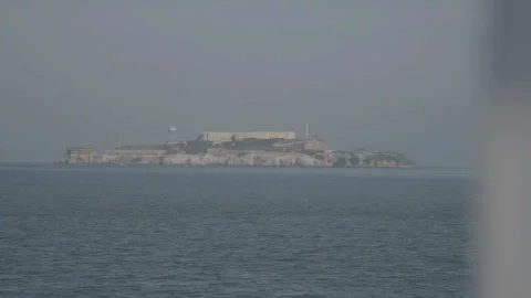 San Francisco, CA - Dec 15, 2024: Alcatraz prison middle ground with ocean foreg Видео 333580803